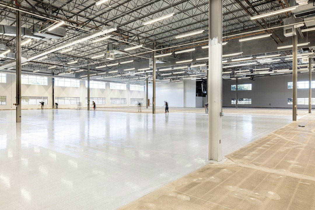 Empty, modern warehouse interior with polished concrete floor in Allen, TX