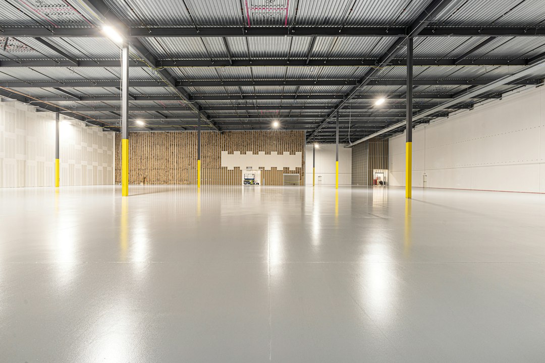 Spacious empty warehouse interior with polished concrete floor in Allen, TX