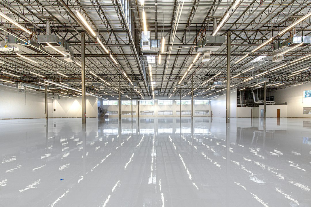Shiny warehouse floor with overhead lights and ceiling in Allen, TX